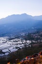 Tourists with cameras waiting for sunrise at the Terrace of Yuanyang Rice Terraces