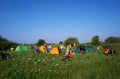 Tourists camping in the field, campground in the meadow