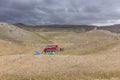Tourists camping in Mongolian hills. Three tents under the open cloudy sky
