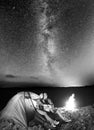 Tourists in camping at night against starry sky Royalty Free Stock Photo