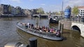 Tourists on canal, Amsterdam, Holland