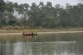 Tourists on a canoe safari at Chitwan national park on Nepal Royalty Free Stock Photo