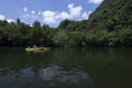 Tourists canoe to visit the island in Southern Thailand.