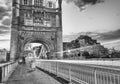 Tourists and car light trails at night along Tower Bridge, London in summer Royalty Free Stock Photo