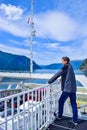 Tourists and cars on a ferry boat, crossing the Sognefjord in Norway Royalty Free Stock Photo