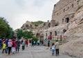 Tourists and caves at Yungang Grottoes Royalty Free Stock Photo