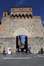 Tourists at the city gate of San Gimignano in Italy