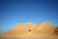 Tourists climb on camel head rock Royalty Free Stock Photo