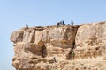 Tourists climb down the ropes from the cliff where the city of Mitzpe Ramon is located in the Judean Desert in Israel