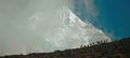 Tourists climb the mountain range