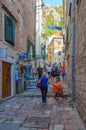 Tourists climb narrow street of Old City to fortress, Kotor, Montenegro Royalty Free Stock Photo