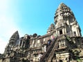 Tourists climb the steps at a temple at the Angkor Complex, Cambodia