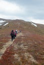 Tourists climb to the top of Runa mountain in Carpathians Royalty Free Stock Photo