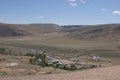 Tourists climb the trail to the mountains of the Chagan-Uzun Martian landscape in Altai.