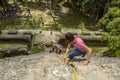 Tourists Climbing Down Mayan High Temple in Lamanai, Belize