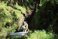 Tourists climbing iron ladders in Slovak Paradise