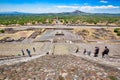 Tourists climbing landmark ancient Teotihuacan pyramids in Mexican Highlands