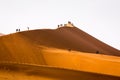 Tourists climbing sand dune Sossusvlei namibia Royalty Free Stock Photo