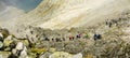 Tourists climbing up to the popular Rysy peak. Tatra Mountains.