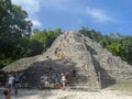 Tourists at the Coba pyramid structure in Quintana Roo, Mexico Royalty Free Stock Photo