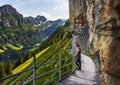 Tourists coming to the mountain guesthouse Aescher-Wildkirchli in the Swiss Alps