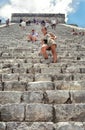 Tourists conquering Chichen Itza main pyramid.