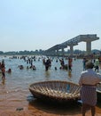 Tourists and coracles at Kaveri River Beach in Talakadu, Mysore