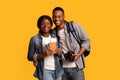 Tourists Couple. Happy african lovers holding passports with tickets and photo camera Royalty Free Stock Photo