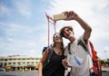 Tourists couple taking selfie with the giant swing in Bangkok Thailand