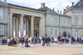 Tourists in the courtyard in front of the Amalienborg palace waiting for changing of the guard, Copenhagen, Denmark Royalty Free Stock Photo