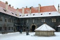 Tourists are in courtyard of Krumlov Castle, Cesky Krumlov, Czech Republic