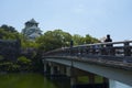 Tourists cross the bridge to Osaka Castle