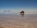 Tourists cross the flooded Salar de Uyuni. Uyuni, Bolivia