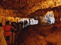 tourists cross the spectacular Neptune caves in Sardinia