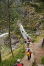 Tourists crossing a bridge in the Himalayas