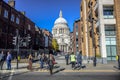 Tourists crossing the street in the city of London with Saint Paul`s Cathedral in background, London, England, UK Royalty Free Stock Photo
