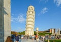 Tourists crowd the busy Piazza dei Miracoli as they view the Leaning Tower in Pisa, Italy