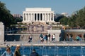 Tourists crowd National Mall and Lincoln Memorial with waterfeature and Reflecting Pool Royalty Free Stock Photo