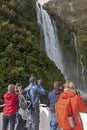 Tourists on the cruising boat approaching Stirling Falls , Milford Sound, Fiordland, South Island of New Zealand Royalty Free Stock Photo