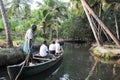 Tourists cruising on a canoe a river of the backwaters at Kollam Royalty Free Stock Photo