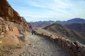 Tourists descend on the long trail to Mount Moses, Egypt Royalty Free Stock Photo