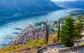 Tourists descend on steps at ancient fortress walls over Kotor and Bay of Kotor, Montenegro Royalty Free Stock Photo