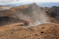 Tourists descending on lava field