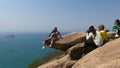 Tourists of different nationalities taking a photo.