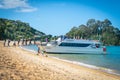 Tourists disembark onto Kaiterteri Beach Tasman New Zealand