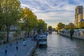 Tourists on Docks at Notre Dame Cathedral in Paris Under Sunny Sky With Trees