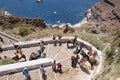 Tourists on donkeys cab in Santorini island, Greece