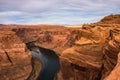 Tourists at the edge of Horseshoe Bend in Arizona Royalty Free Stock Photo