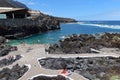 Tourists in the El Caleton natural pools next to the old fishing port of Garachico, Tenerife. Spain