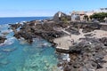 Tourists at the El Caleton natural pools next to the San Miguel castle in Garachico, Tenerife. Spain